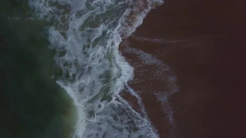 Aerial Shot slow forward looking down at waves Stock Footage 161593585
