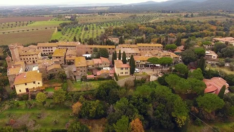 Aerial shot, a small ancient town situated in the middle of rural landsca Stock Footage