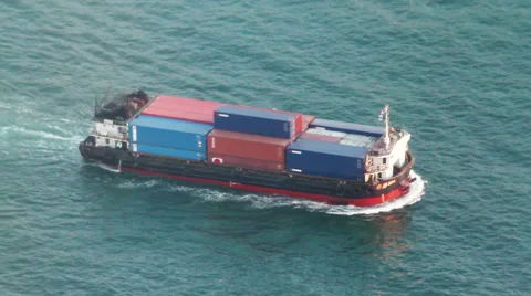 Aerial shot of small container ship crossing the habour Stock Footage 55694985