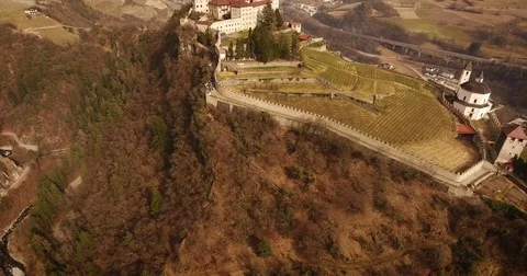 Aerial shot, a small perched town Chiusa in Italy, Sud Tirol, in the mid Stock-Footage 75397385