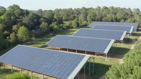 Aerial shot of a small solar panel farm in the heart of the forest Stock Footage 240975630