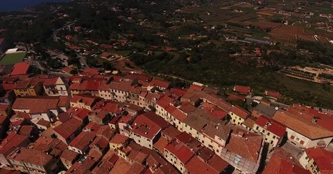 Aerial shot of a small town Capoliveri and a gorgeous paradisiac sea in Stock Footage