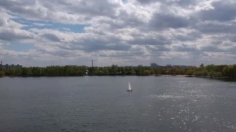 Aerial shot small  train sailing yacht float city park lake Stock Footage 107706201