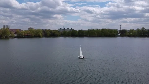 Aerial shot small  train sailing yacht float city park lake Stock Footage 107706213