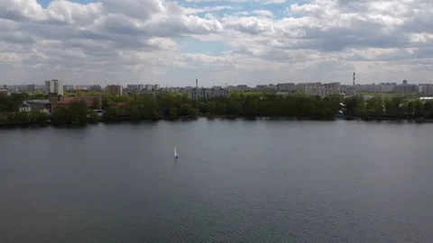 Aerial shot small  train sailing yacht float city park lake Stock Footage 107706224