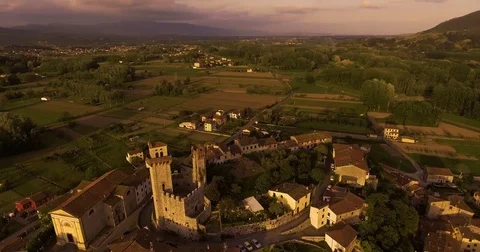 Aerial shot, a small tuscan hamlet Nozzano castello on the hill in the sunset Stock-Footage 80914550