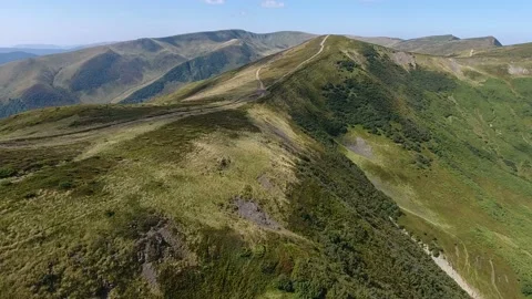 Aerial shot of a snake looking range of the Carpathians on a sunny day in summer Stock Footage 86607258