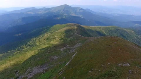 Aerial shot of a snaky footpath on a Carpathian ridge Stock Footage 86393853