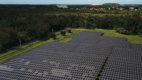 Aerial shot of solar panel array in a field producing green renewable energy Stock Footage 141229948