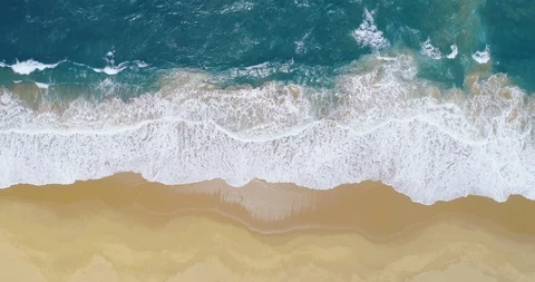 Aerial shot split in thirds by beach surf and deep ocean waves vertical 4K Stock-Footage 87571967