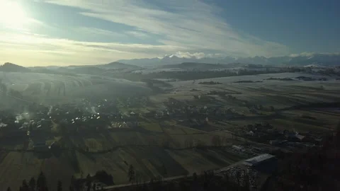 Aerial Shot. Static camera over small town in Polish Tatra mountains. Sunrise.   Stock Footage 147631139