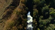 Aerial Shot Of Steam Train Coming Into Station Stock Footage