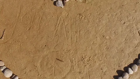 Aerial Shot, straight down over a stone heart on South Lake Tahoe Beach 003219 Video stock 90565161