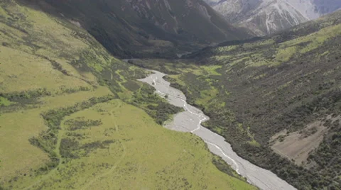 Aerial shot of a stream and a mountain Stock Footage 34257385