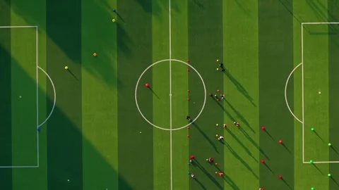 Aerial shot of Students Practicing Soccer on Green Field Video stock 325079731