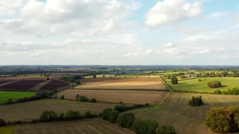 Aerial shot of the Sun falling on fields Stock Footage 250627481
