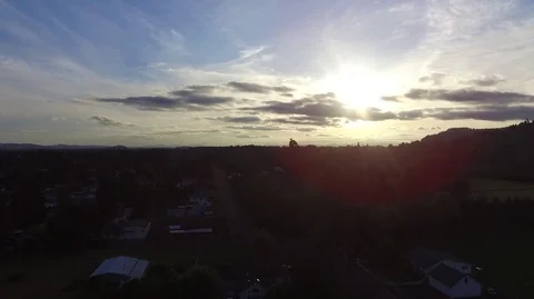 Aerial Shot of Sunset With Clouds and Birds Flying By Stock Footage 76142243