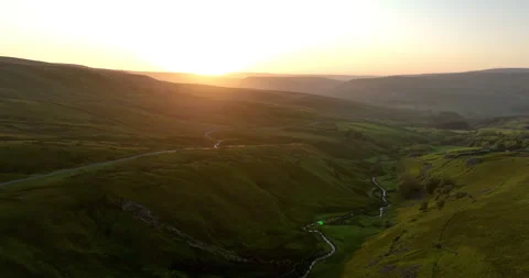 Aerial shot of a sunset over river in a valley Stock-Footage 282835339
