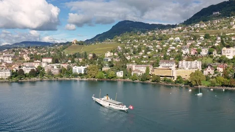 Aerial shot of Swiss excursion ship at Montreux on Lake Geneva shoreline Stock Footage 124246725