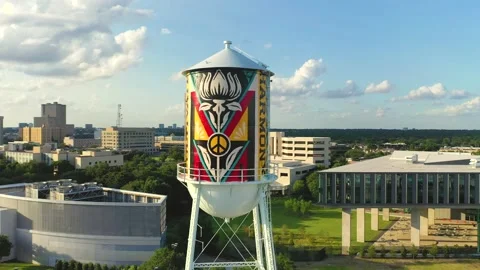Aerial shot of Texas Water Tower and Dallas Skyline and Sunset in background. Stock Footage 164609259