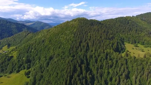 Aerial shot of three sharp peaks in the Carpathian Mountains in summer Stock Footage 90453511