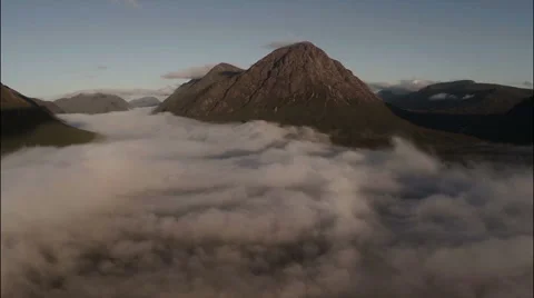 Aerial shot through cloud inversion revealing buachaille etive mor Stock Footage 57964573