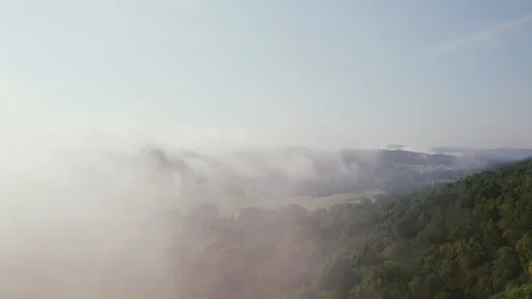 Aerial Shot Through Clouds and Mountains Stockbeeldmateriaal 247984577