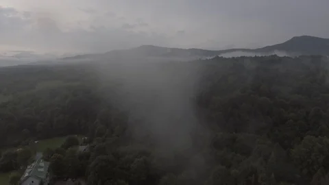 Aerial shot through clouds. Mountain view Stock-Footage 98565621
