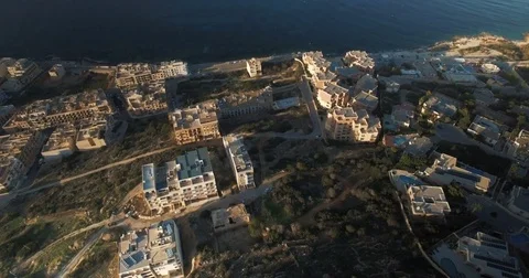 Aerial shot tilting down on Maltese houses Stock Footage 70970442