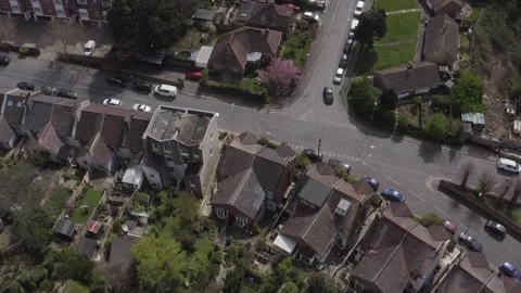 Aerial shot tilting down over a residential street and houses in Hastings Stock Footage 296760404