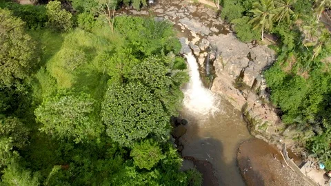 Aerial shot of a tiny waterfall. Stock Footage 111863129