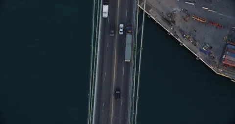 Aerial shot, top down view of traffic, pan out to shipping port, drone Stock-Footage 115293190