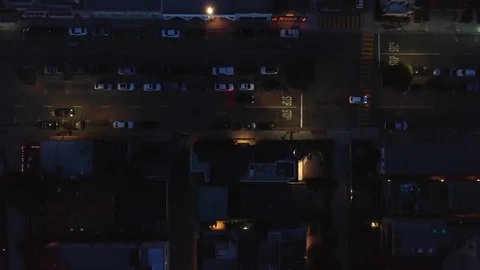 Aerial shot top view roof of building street with road and car at night city Stock Footage 127602556