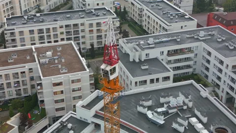 Aerial shot of a tower crane with a rotating mechanism on top. Stock Footage 287986568