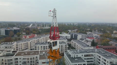 Aerial shot of a tower crane with a rotating mechanism on top. Stock Footage 287986713