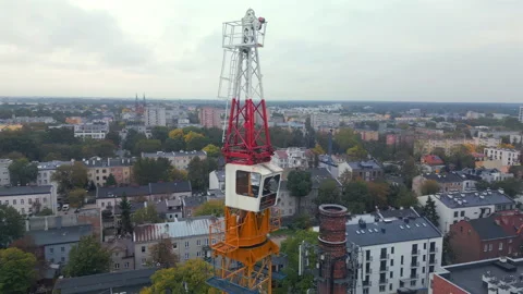 Aerial shot of a tower crane with a rotating mechanism on top. Stock Footage 287986789