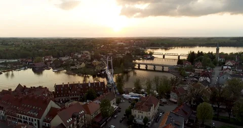 Aerial shot of town located between two lakes during poetic sunset Stock Footage 89415850