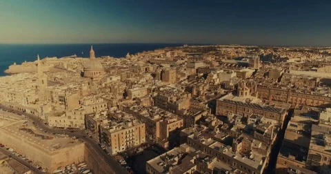Aerial shot tracking backwards over Valletta Stock Footage 73814480
