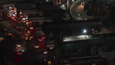 Aerial shot, tracking forward, of traffic and road construction in Bengaluru, In Stock Footage 304545541
