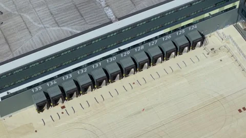 Aerial Shot Tracking Over Cargo Loading Docks at Newly Constructed Logistics Stock Footage 342855190
