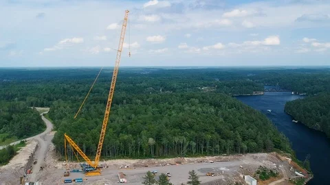 Aerial shot tracking right to left giant bridge construction crane. Stock Footage 112357949