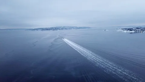 Aerial shot of tracking a speed ferry boat in Oslo fjord, Norway in winter Stock Footage 86237980