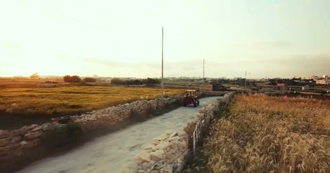 Aerial shot of a tractor in the middle of the fields Stock Footage 75167537