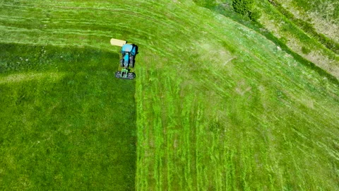Aerial Shot Of Tractor Mowing Grass Field In Poland Stock Footage 336708209
