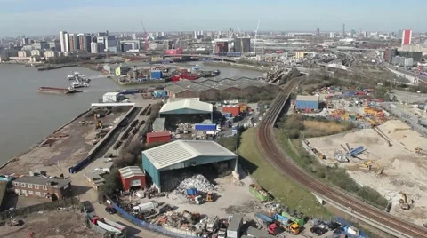 Aerial shot of train passing by construction site, Long sequence Stock Footage 47784030