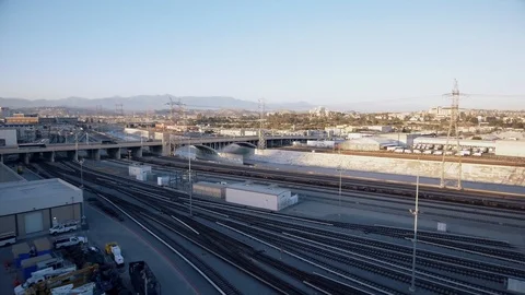 Aerial shot of train tracks and road in Los Angeles, CA Stock Footage 89850090