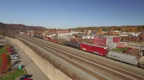 Aerial Shot of Train on Tracks Below New Brighton, PA Stock Footage 58333076