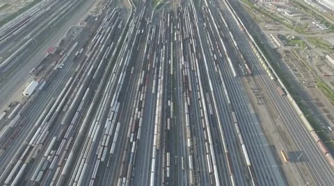 Aerial shot train tracks camera tilting up overlooking city landscape Stock Footage 61114458