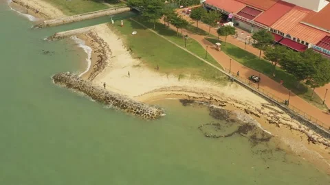 Aerial shot of trash &amp; garbage on beach ,East Coast Park, Singapore Stock Footage 137280572