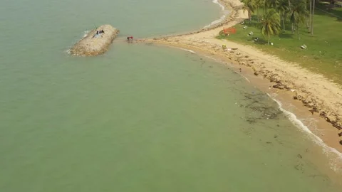 Aerial shot of trash &amp; garbage on beach ,East Coast Park, Singapore Stock Footage 137280579